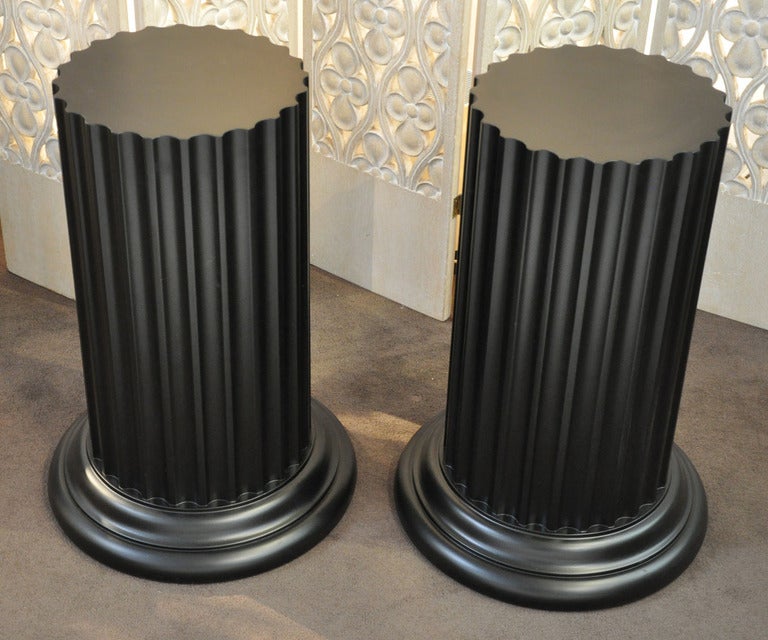 Pair of side tables signed John Widdicomb. Each column is carved wood with a  hand rubbed lacquer finish. 
Price is for the pair.