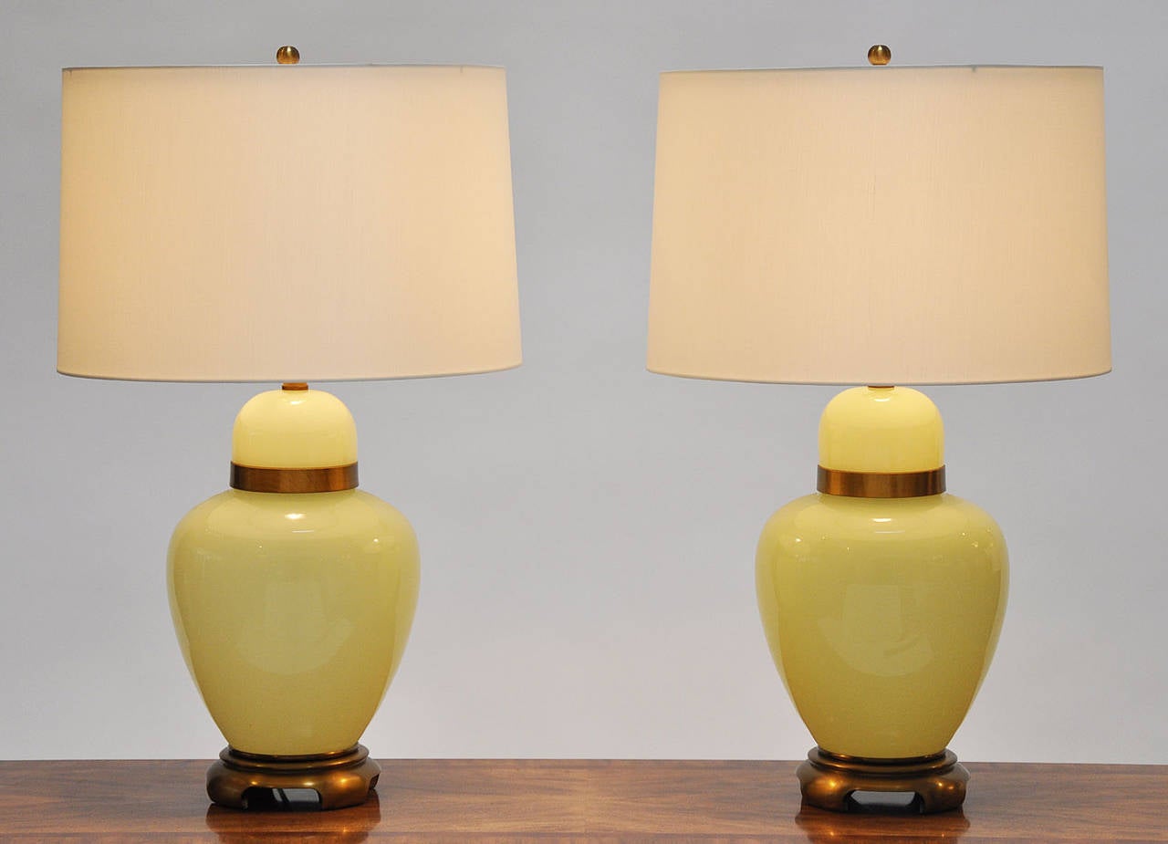 Beautiful pair of Italian glass and brass lamps. Patinated brass bases and fittings. New custom white silk shades with diffusers. Glass portion measures 15.5