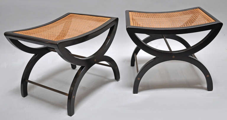 Pair of cane and mahogany benches.
Cane seats, mahogany frames and brass stretchers. Designed by Edward Wormley for Dunbar Furniture, model 5006.
Price is for the pair.
