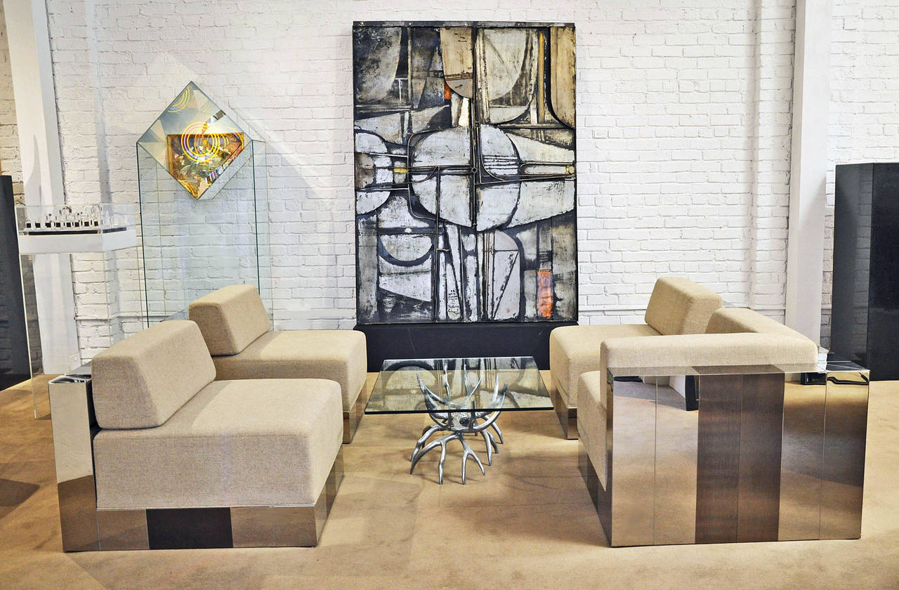 Cityscape modular sofa. Use the four pieces together or apart. Polished steel and anodized brass over wood. New upholstery. Each piece is finished on all sides. Designed by Paul Evans (1931-1987).
Corner piece measures: 35
