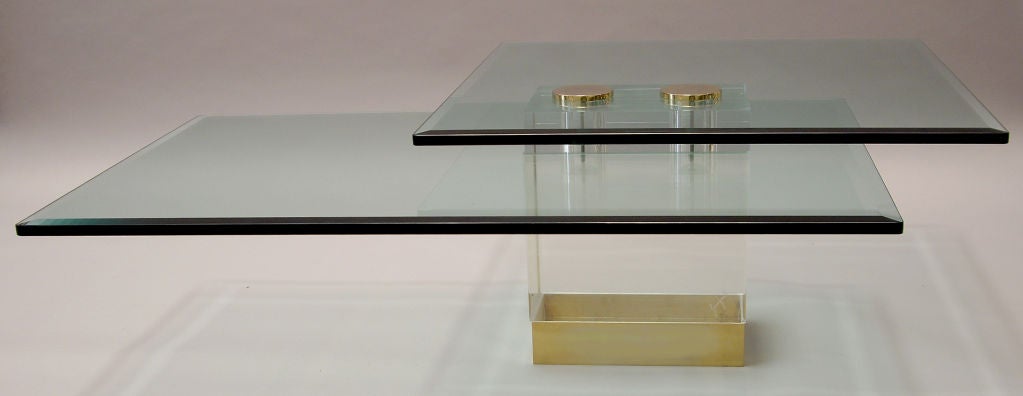 Fantastic double level glass, Lucite and brass coffee table made by Lion and Frost. Signed. The Lucite base is a solid cube.