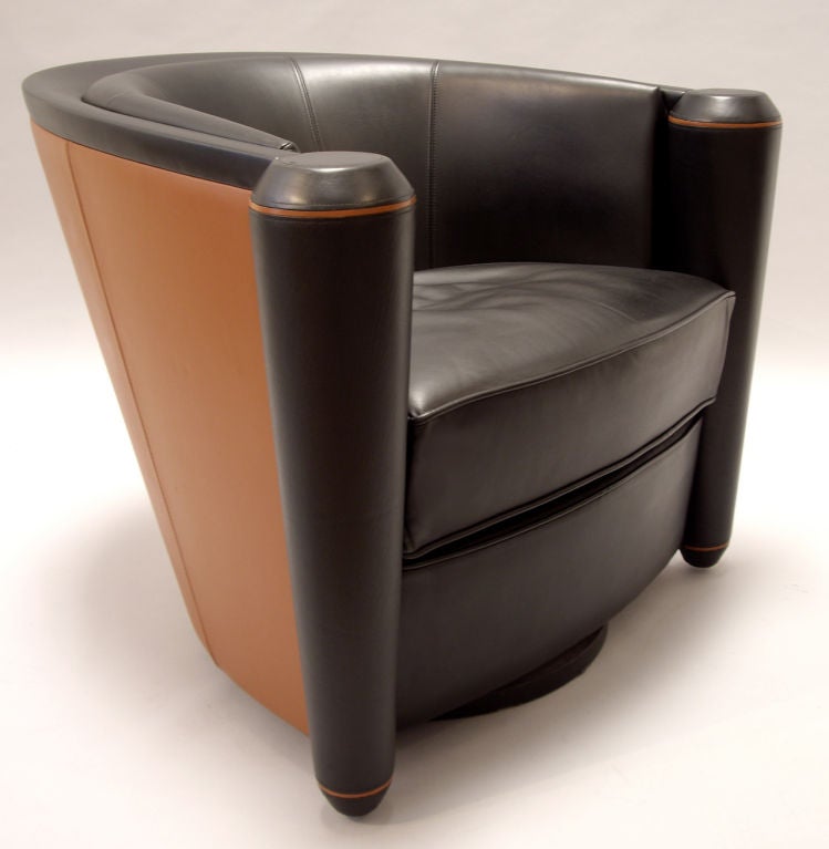 Pair of extremely comfortable leather club chairs designed by Adam Tihany for the Pace collection in 1990.<br />
The chairs swivel easily. Iconic design with the finest hand crafted leather. <br />
Price is for the pair.