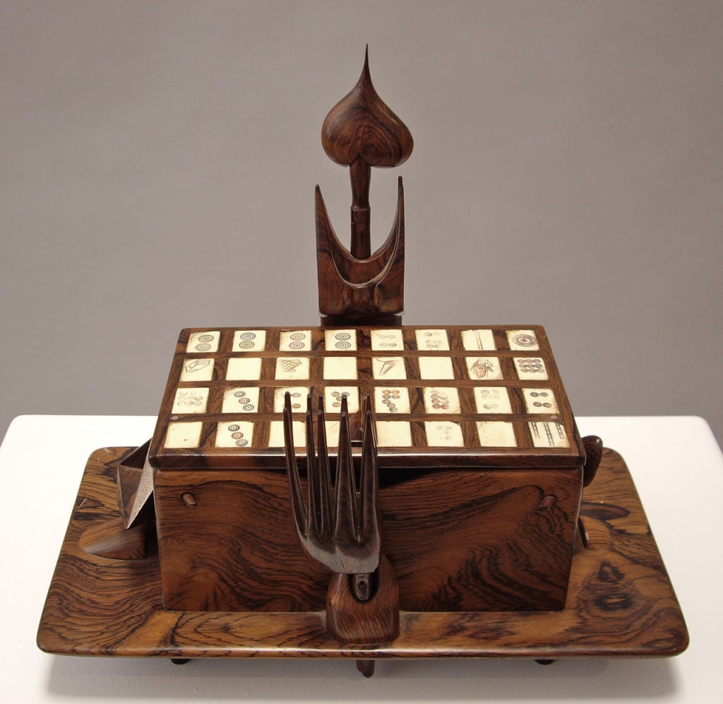 A sculptural box made out of exquisete rosewood with antique mahjong tiles set in the lid.<br />
Provenance: from the estate of Jan de Swart<br />
The work of Jan de Swart, in it's unique interrelationship of art, applied science, and the newest