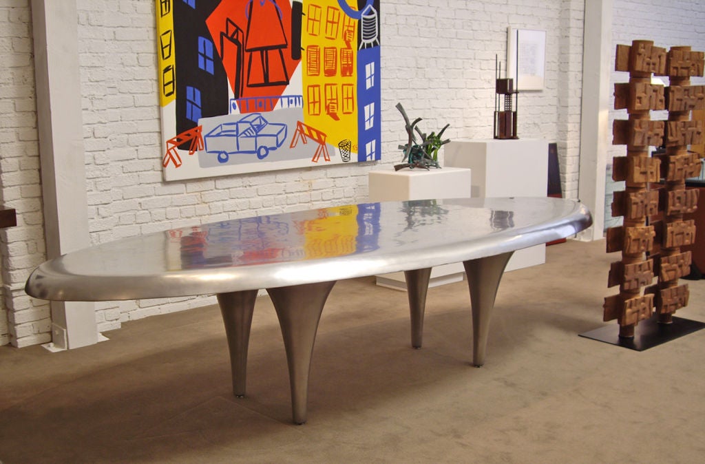 Massive metal surfboard shaped dining table by architect, designer Larry Totah. <br />
Totah is well know for his modern architecture and minimalist modern furniture.<br />
 Some of his better known projects include Maxfield/Architecture/Interior
