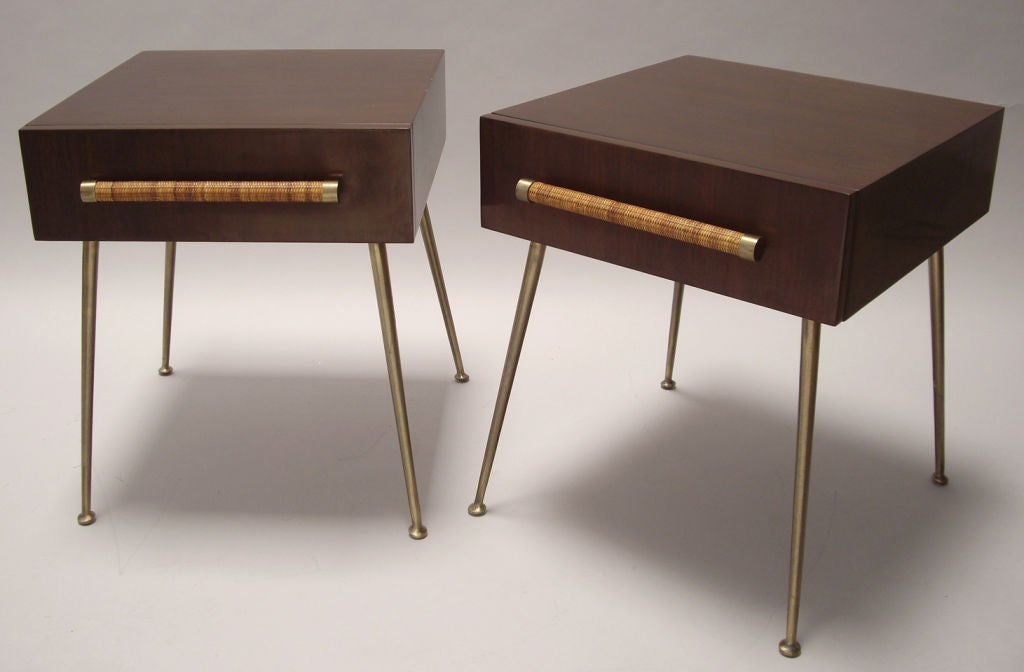 Pair of nightstands or end tables by T.H. Robsjohn Gibbings for Widdicomb. Each features one drawer with a cane wrapped handle. Price is for the pair.