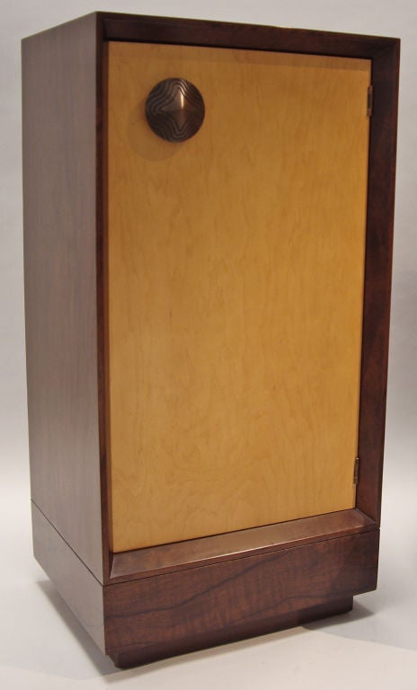 Cabinet designed by Gilbert Rohde for Herman Miller. <br />
Features two interior shelves.