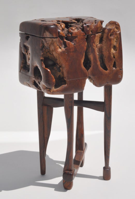 Unique hinged burl wood box on sculpted legs. The box opens to reveal a burl wood pod nestled inside. The pod opens and has just enough room for a small treasure.
This sculpture/box was created by California artist, Jan de Swart.
Provenance: from