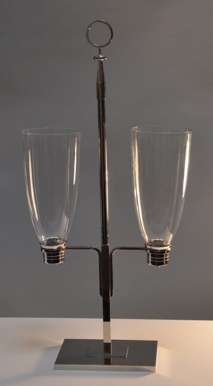 Rare double candleholder with original glass hurricane shades. Silver plate, designed by Tommi Parzinger for Dorlyn. Signed.