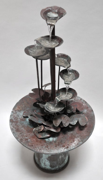 Hand made copper water fountain. Artist crafted. The fountain is electrified and provides a continuous flow of water.