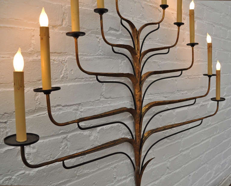 Beautiful 1960's ten light wall candelabra. Hand crafted metal with electrified candles. 