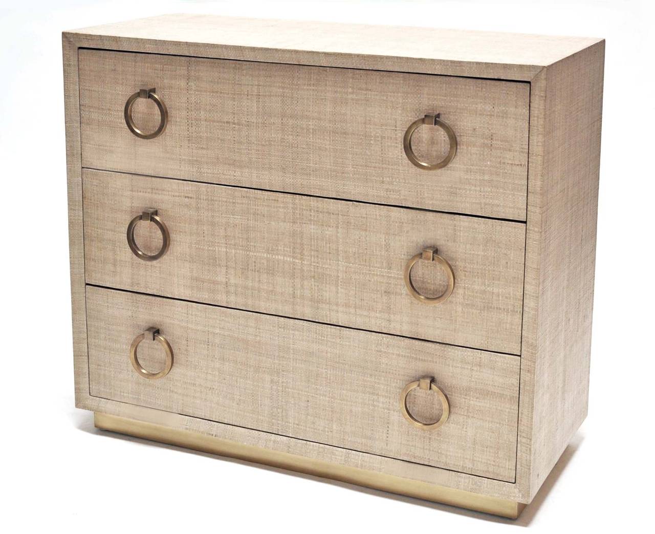 Pair of grasscloth covered dressers with brass pulls. Finished on all sides. Interior drawers are finished mahogany. Price is for the pair.