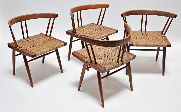 Set of four grass seated chairs by iconic Japanese American woodworker, George Nakashima (1905-1990). Hand crafted for style and comfort.
These chairs were purchased directly from the Nakashima studio circa 1950. Included with purchase is a letter