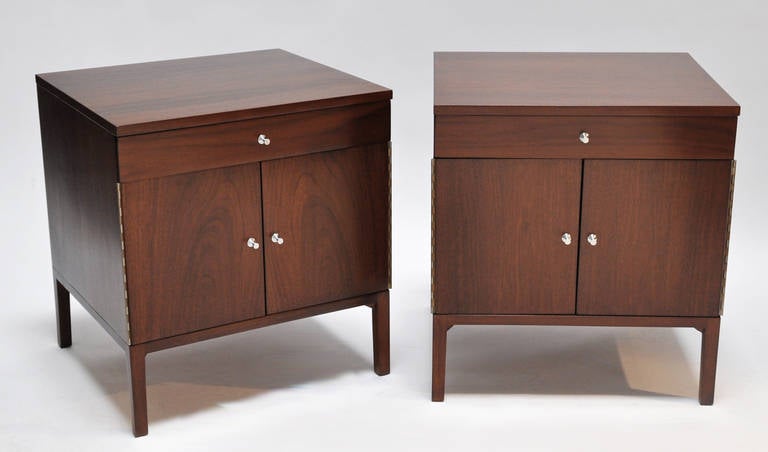 Matching walnut nightstands or sofa tables designed by Paul McCobb for Calvin Furniture. (Original labels) Featuring steel pulls, folding doors, and adjustable shelves. Finished on all sides. Price is for the pair.