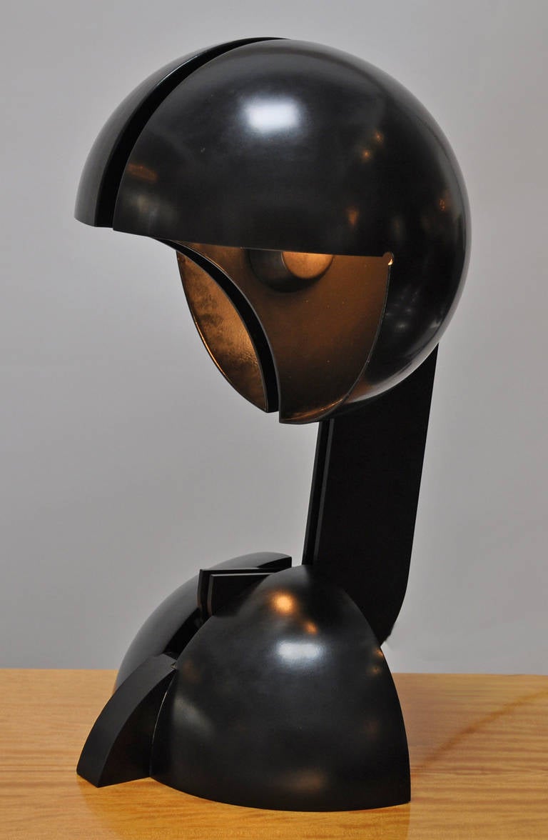 An icon of Italian design, the La Ruspa table lamp was designed by Italian designer Gae Aulenti for Martinelli Luce in 1967-1968. The design allows the lamp to move and adjust to direct the light source. The light can be adjusted to be direct or