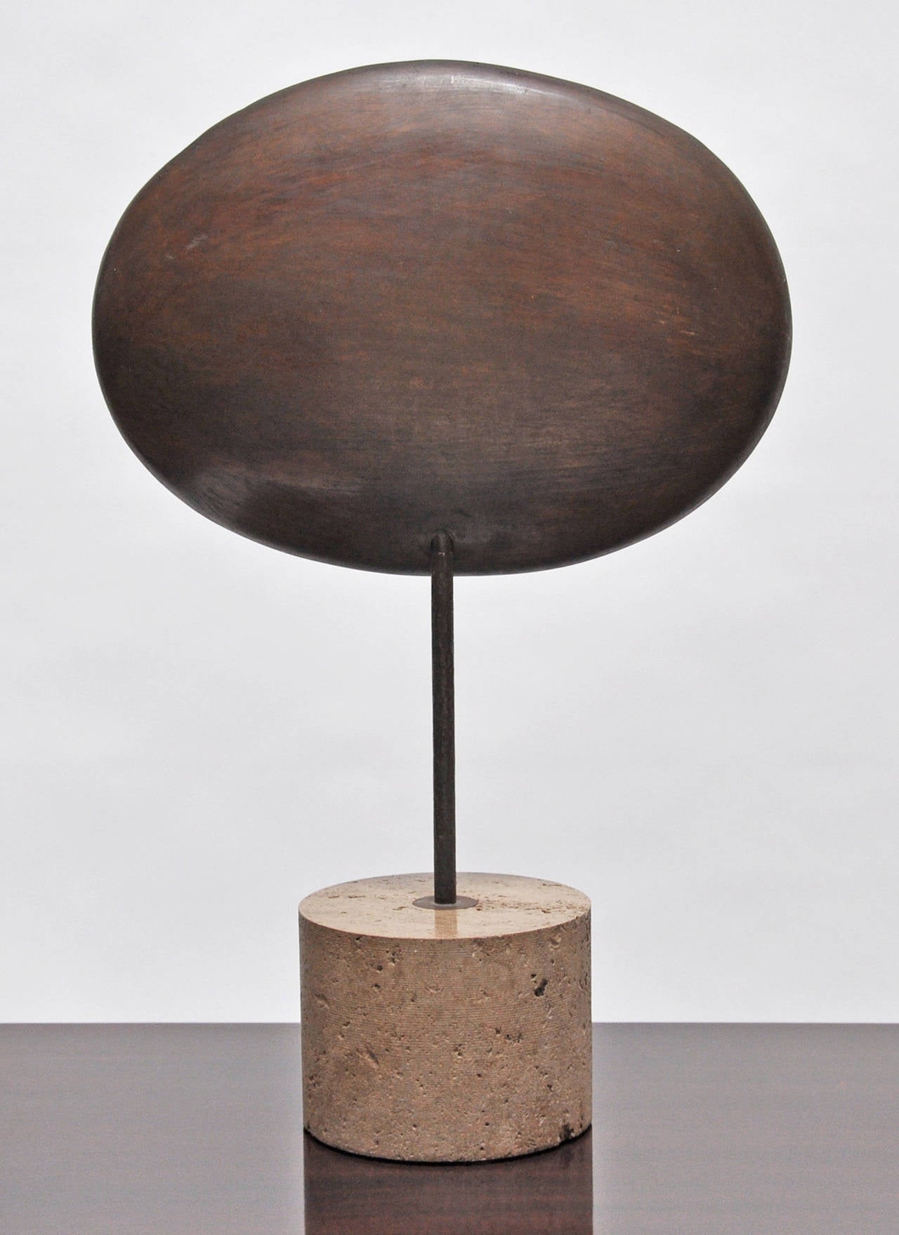 Modernist bronze sculpture by Amalia Schulthess (American 1918-). Mounted on a travertine base.
Amalia Schulthess was the subject of a retrospective at the Santa Barbara Museum of Art in 1976.
Measures: The depth of the sculpture is 3 inches.
The