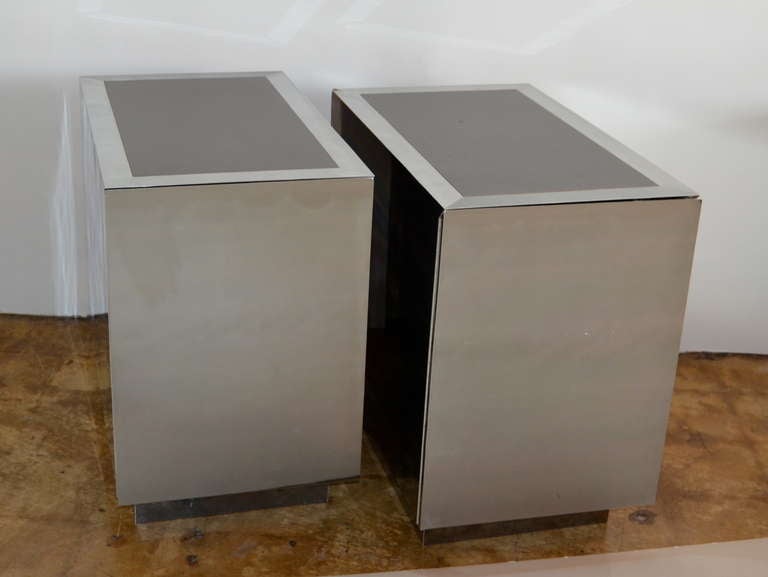 Completely clad in chrome with black laminate tops. Marked 
