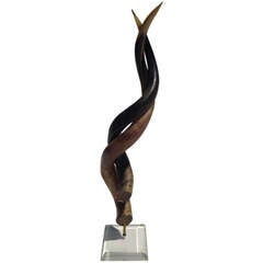 Intertwined Horns on Lucite Base