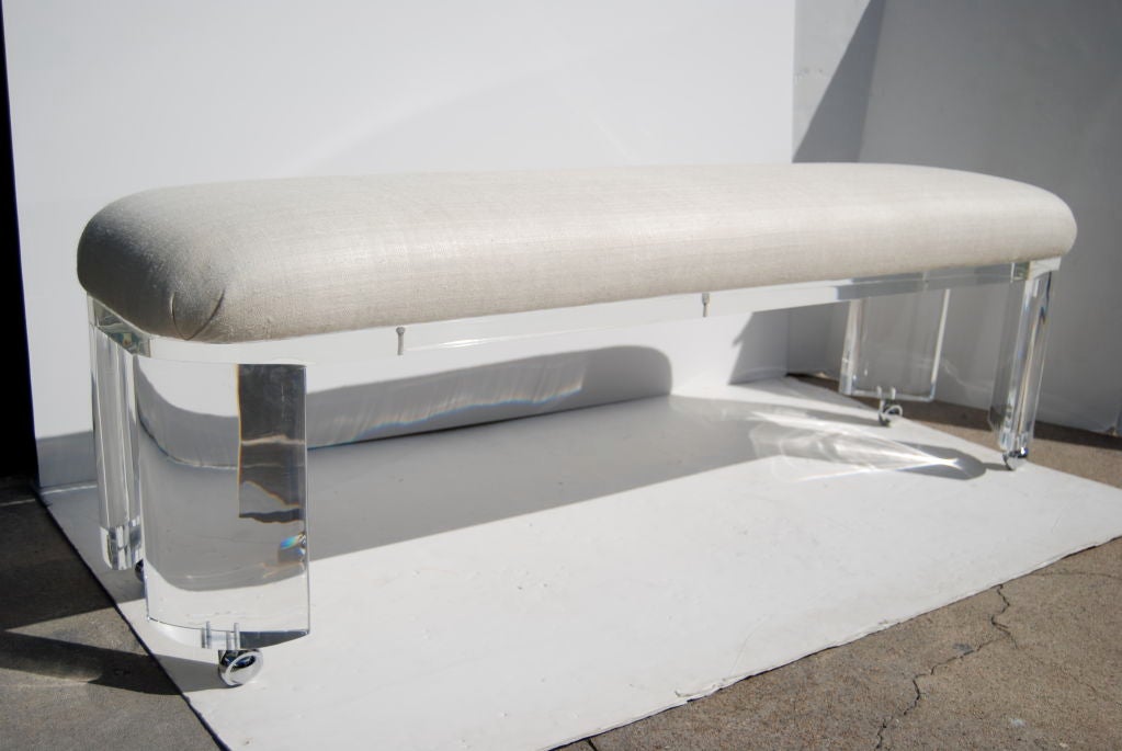 A great bench with very thick walled lucite prismatic legs. A classic design.
