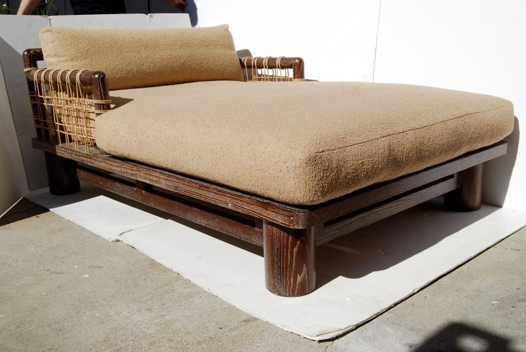 If you have the space, this chaise longue is for you!  At nearly the size of a Fiat, you and your loved one can lay in the lap of luxury, surrounded by plush cushions, subaqueous cerused wood and rattan roping. This is a rare and incredible