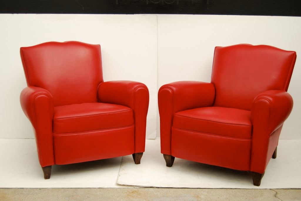 This is a sumptuous and sultry pair of chairs that have been restored in a vivacious and supple red leather. They are extremely comfortable, Classic and very French.