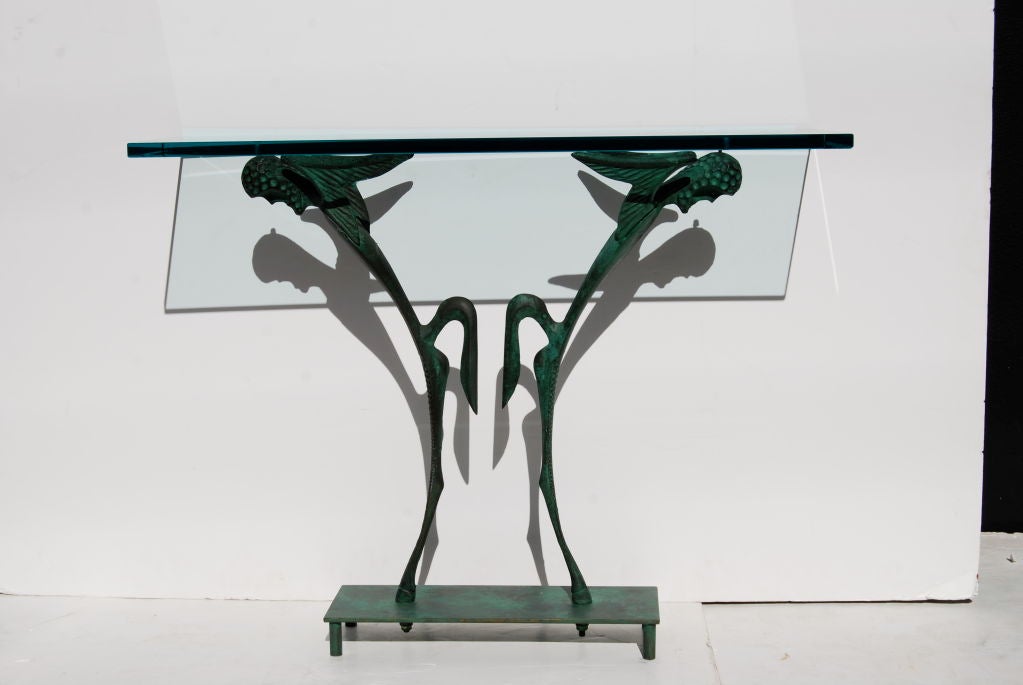 A completely unique bronze and glass console. The only one ever executed.
Amazing.