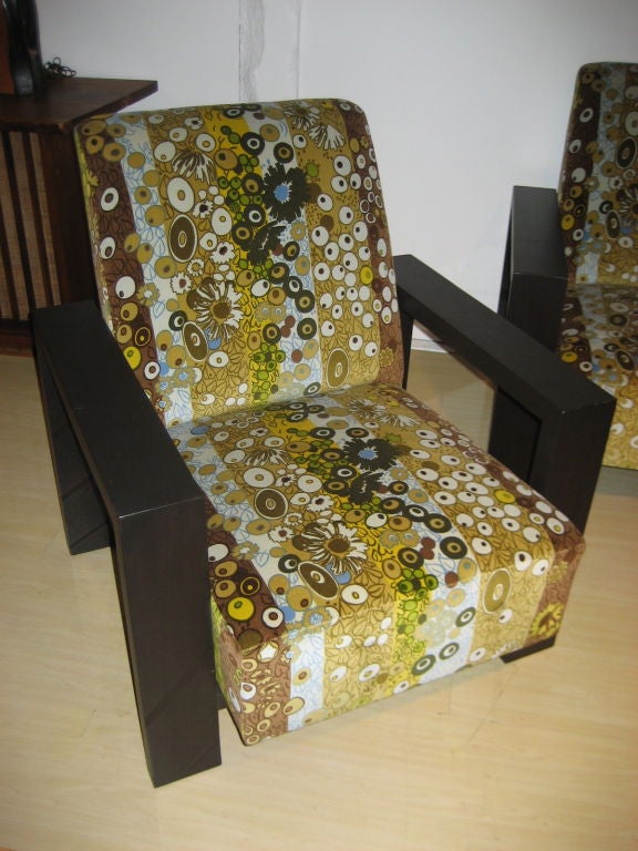 A boldly scaled pair of chairs upholstered in the iconic 