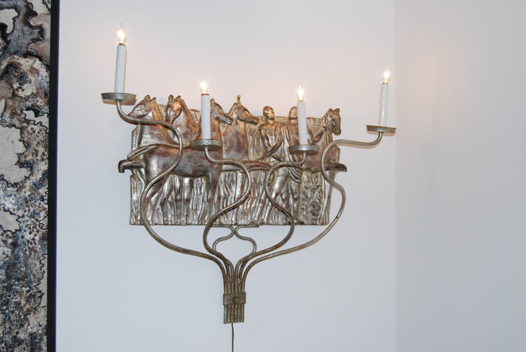 A fabulous and early, pair of custom Michael Taylor silver leaf sconces.