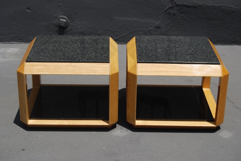 A very nice pair of tables with polished black granite tops.