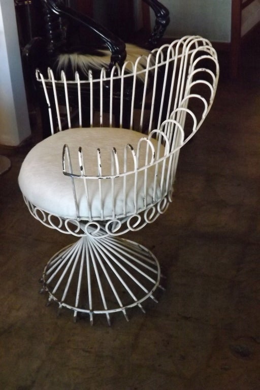 An iconic Matégot chair. White hair on hide seat.