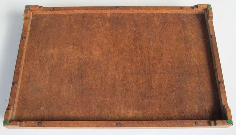 A handsome English rectangular tray with star inlay, wood gallery and handles; the rectangular tray centering an inlaid star surrounded by patterning of exotic woods; all within a wooden gallery and wood handles; above stepped supports