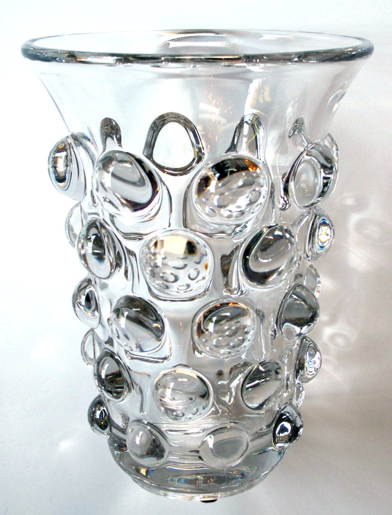 A shimmering French 1960's crystal bulls-eye vase; acid etched mark 'Art Vannes, made in France'; with wide splayed mouth above a bell-shaped body adorned overall with raised spheres