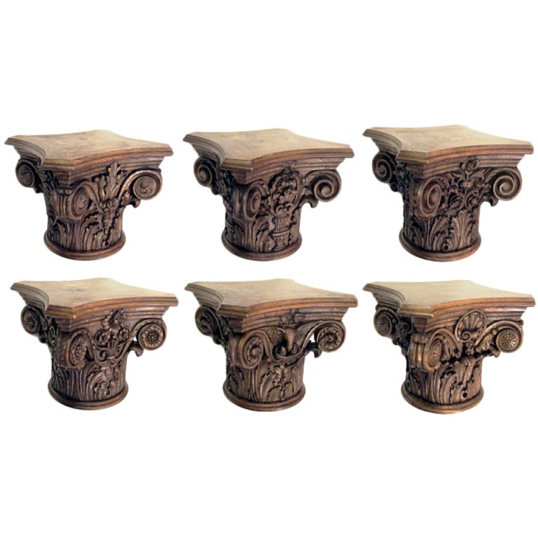 A finely carved set of 6 English oak Corinthian capitals; each hand-carved capital adorned with individualized decoration with scrolling volutes, acanthus leaves, shells, flowers and birds (PRICED INDIVIDUALLY)