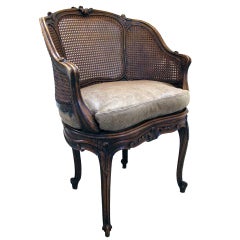 A Shapely French Rococo Style Walnut Bergere With Caned Back & Sides