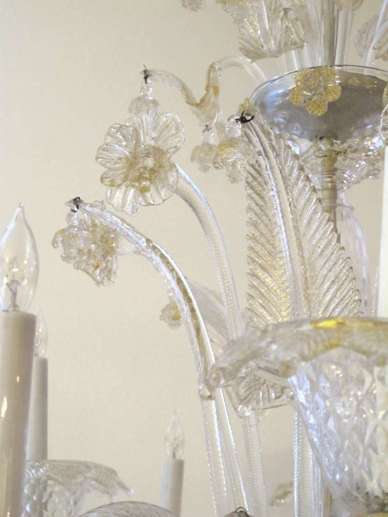 Mid-20th Century A Shimmering and Large-Scaled Murano Mid-Century Clear Art Glass 12-Light Chandelier with Gold Inclusions