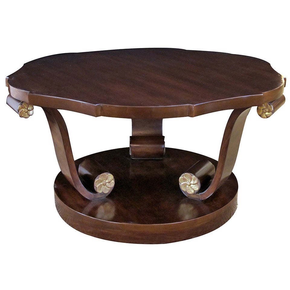 A Handsome American Art Deco Style Mahogany Cocktail Table with Scrolled Legs