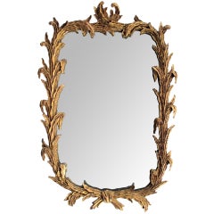 A Well-Carved French Rococo Style Giltwood Mirror with Foliate Vine Frame
