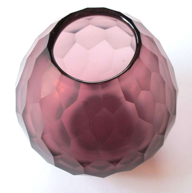 A stylish Moser 1970's amethyst faceted glass vase; the portly vase with faceted surface tapering to the base