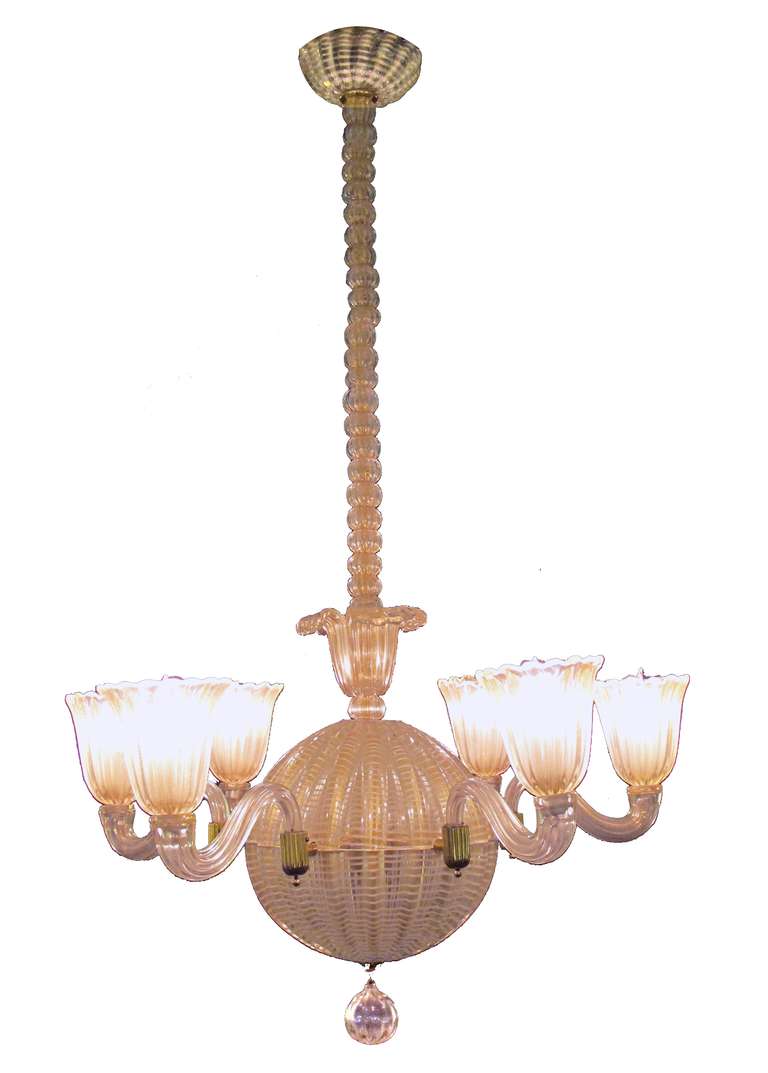 A good quality mid-century Murano six light spheroid chandelier by Dino Martens (1894-1970); the long shaft of stacked glass orbs above a spheroid body emanating six scrolled arms; of white striated glass with gold inclusions; can be shortened