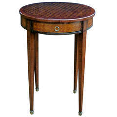 A Tailored French Louis XVI Style Tulip and Kingwood-Veneered Circular Single-Drawer Side Table