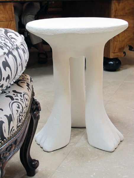 A robust American 1970's white painted plaster three-leg African inspired circular side table by John Dickinson (b.1920 d.1982) Model 101-A; the thick circular top raised on 3 bold paw supports; John Dickinson is considered to be one of the most