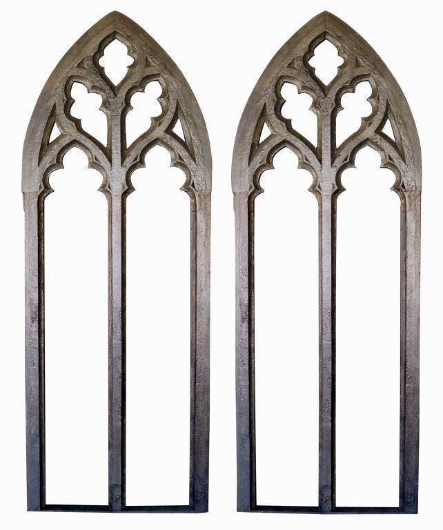 A grand-scaled pair of American neo-gothic gray painted window frames; CAN BE SOLD SEPARATELY; each tall pointed frame with pierced crest above elongated trefoils openings; can be reduced in height; would make striking mirrors