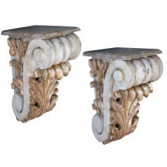 Antique A Dramatic and Large-Scaled Pair of American Classical-Revival Ivory Painted and Parcel-Gilt Wooden Corbels
