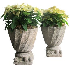 A Handsome and Large-Scaled Pair of French Neo-Gothic Carved Stone Striated Urns on Lion Supports