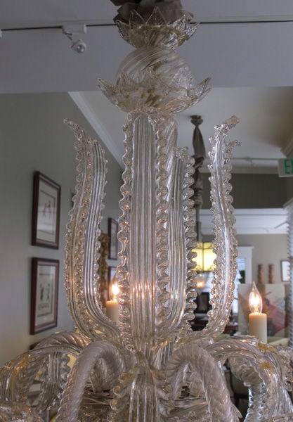 A shimmering Venetian art moderne aventurine-glass 6-light chandelier with large-scaled foliate elements; the baluster support surrounded by boldly-scaled upright leaves; the body emanating 6 scrolling arms interspersed with curvaceous leaves; all
