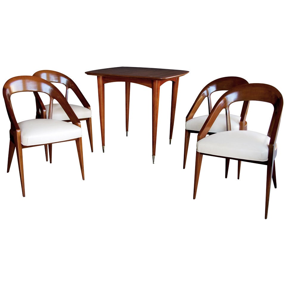 A Stylish French Modernist 1950's Mahogany Game Table With Four Matching Chairs