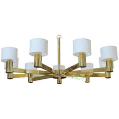 A Stylish Italian 1960
s Brass 9-Arm Chandelier with Linen Shades; labeled 
Arredoluce Monza, Made in Italy
