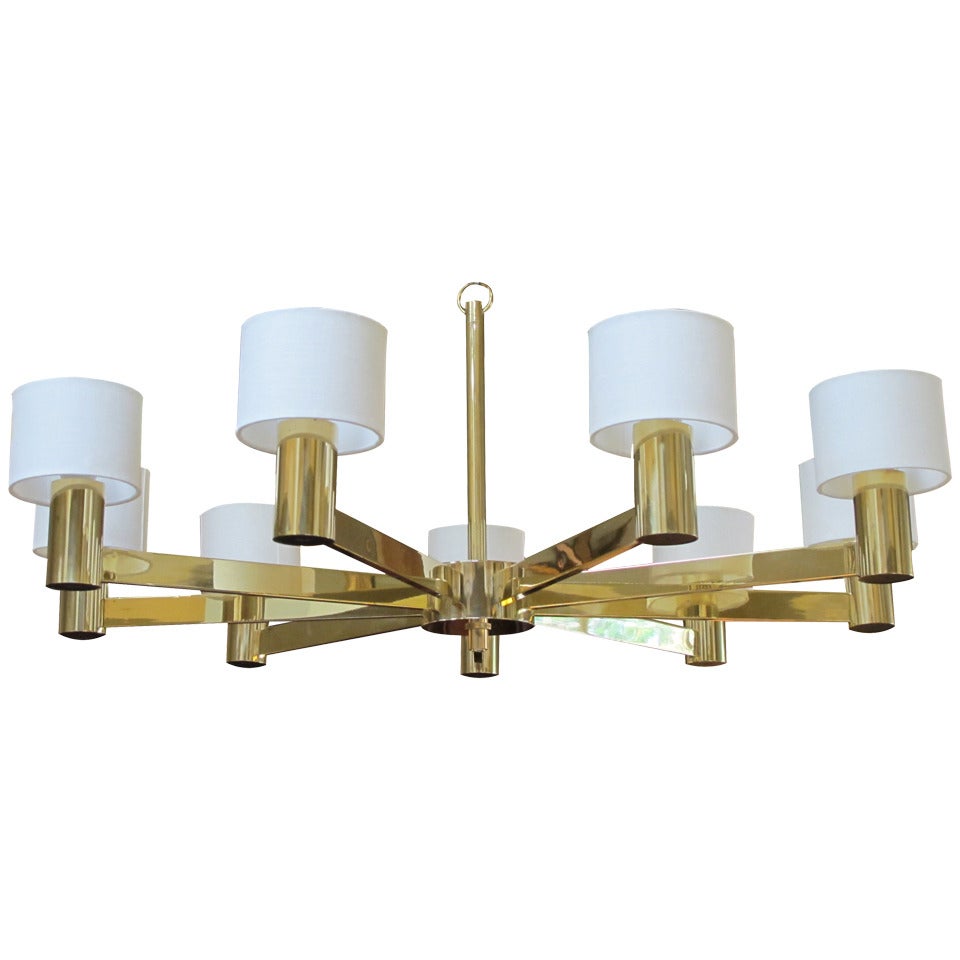 A Stylish Italian 1960's Brass 9-Arm Chandelier with Linen Shades; labeled 'Arredoluce Monza, Made in Italy'