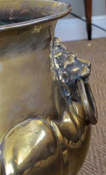 An Exceptional and Large-Scaled Pair of English Hand-Hammered Brass Lobed Jardinieres with Lion Ring Handles 1