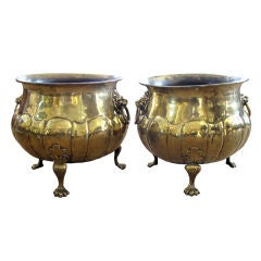 An Exceptional and Large-Scaled Pair of English Hand-Hammered Brass Lobed Jardinieres with Lion Ring Handles