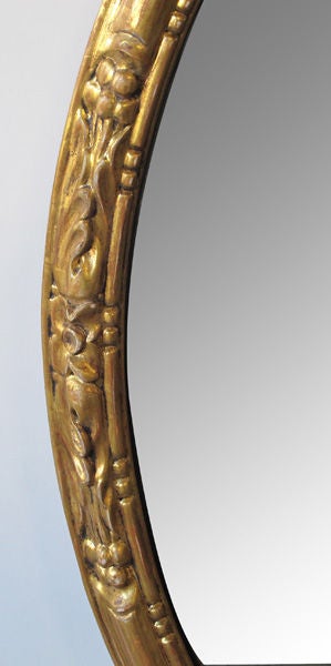 19th Century Elegant Pair of French Napoleon III Carved Giltwood Oval Mirrors For Sale
